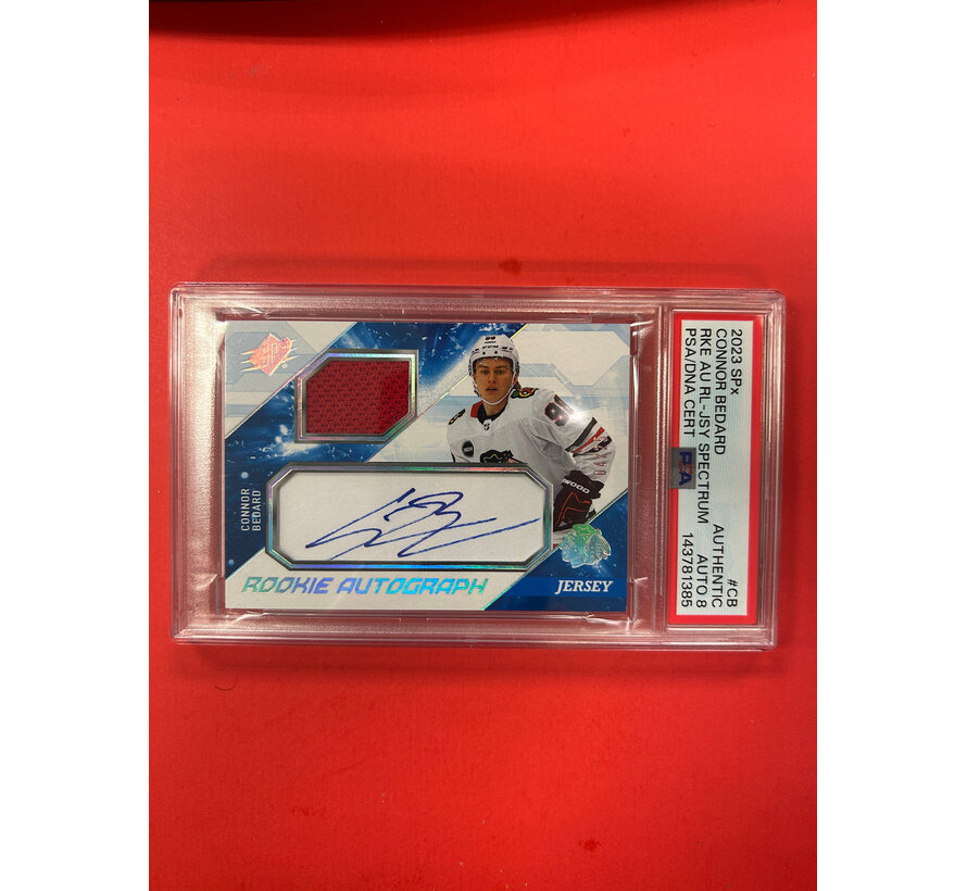 2023-24 UPPER DECK SPX CONNOR BEDARD ROOKIE JERSEY AUTOGRAPH BLUE /25 PSA AUTHENTIC AUTO 8