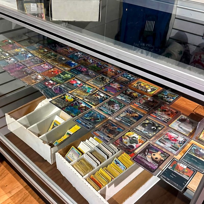 Pokemon card singles in a display case
