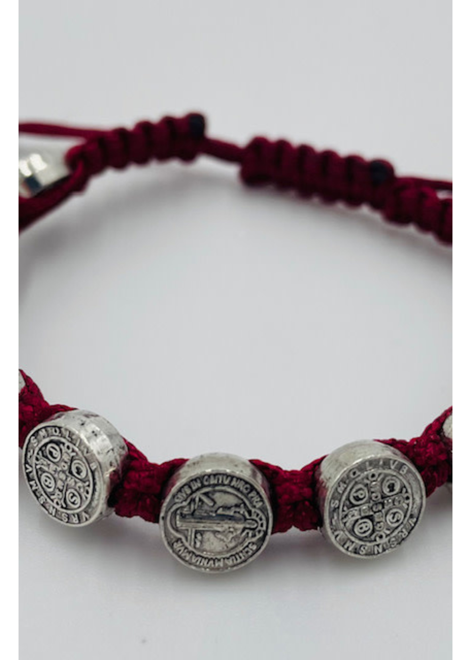 St Benedict red slip knot bracelet with silver tone medals