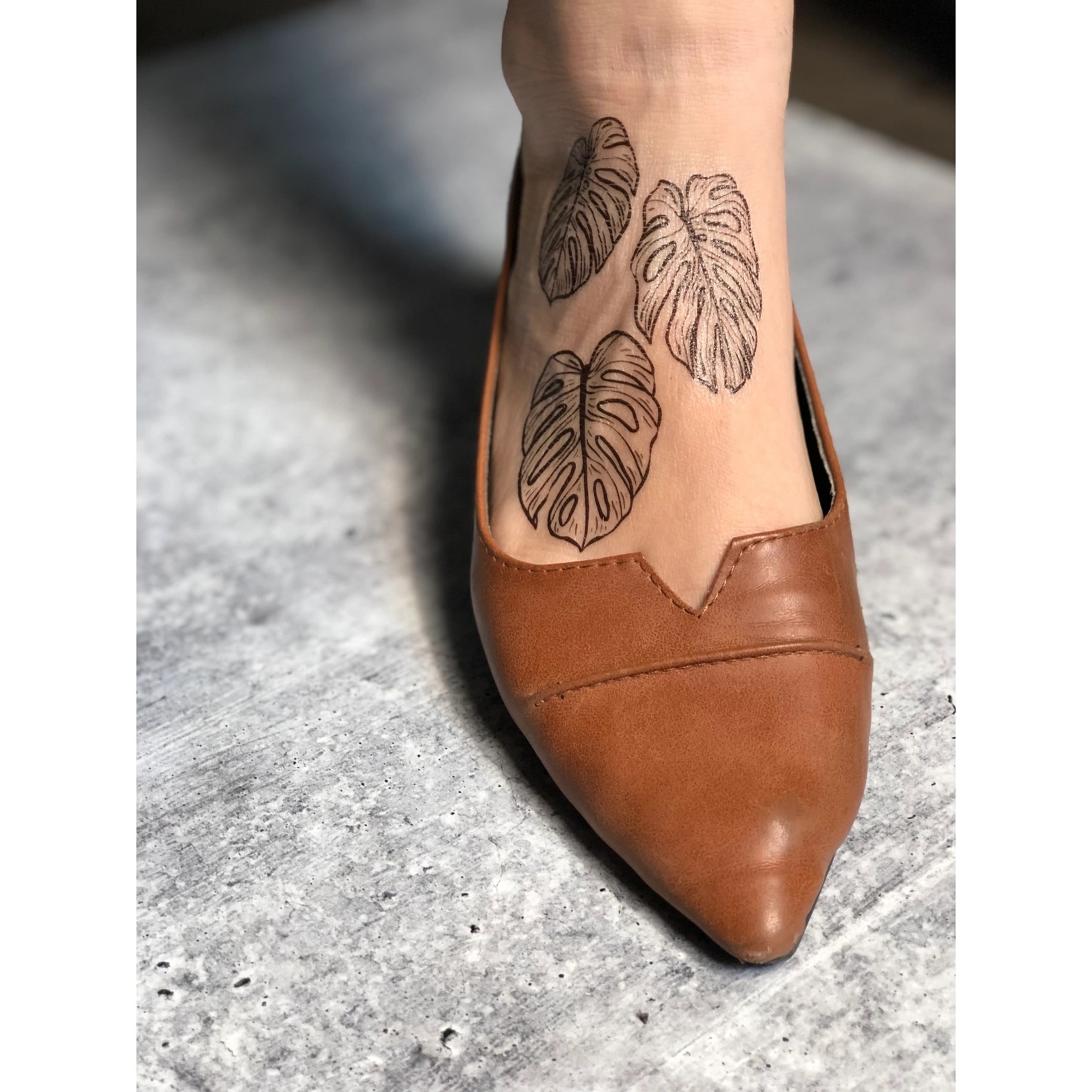 Monstera Tattoo Got my dream tattoo yesterday does this make me a crazy  plant mom The leaves are replicas of leaves from my personal monstera  plant which happened to be my first