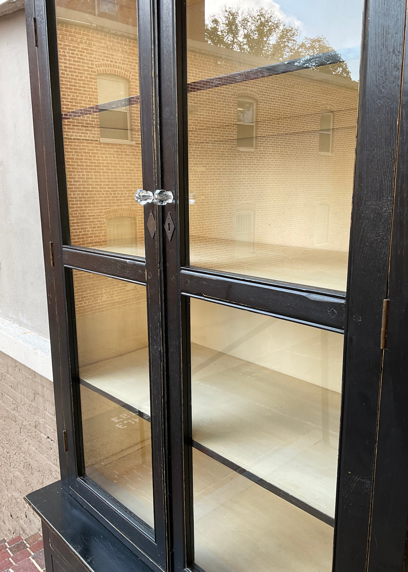 GOODWOOD Four Hands Ebonized Step Back Cabinet