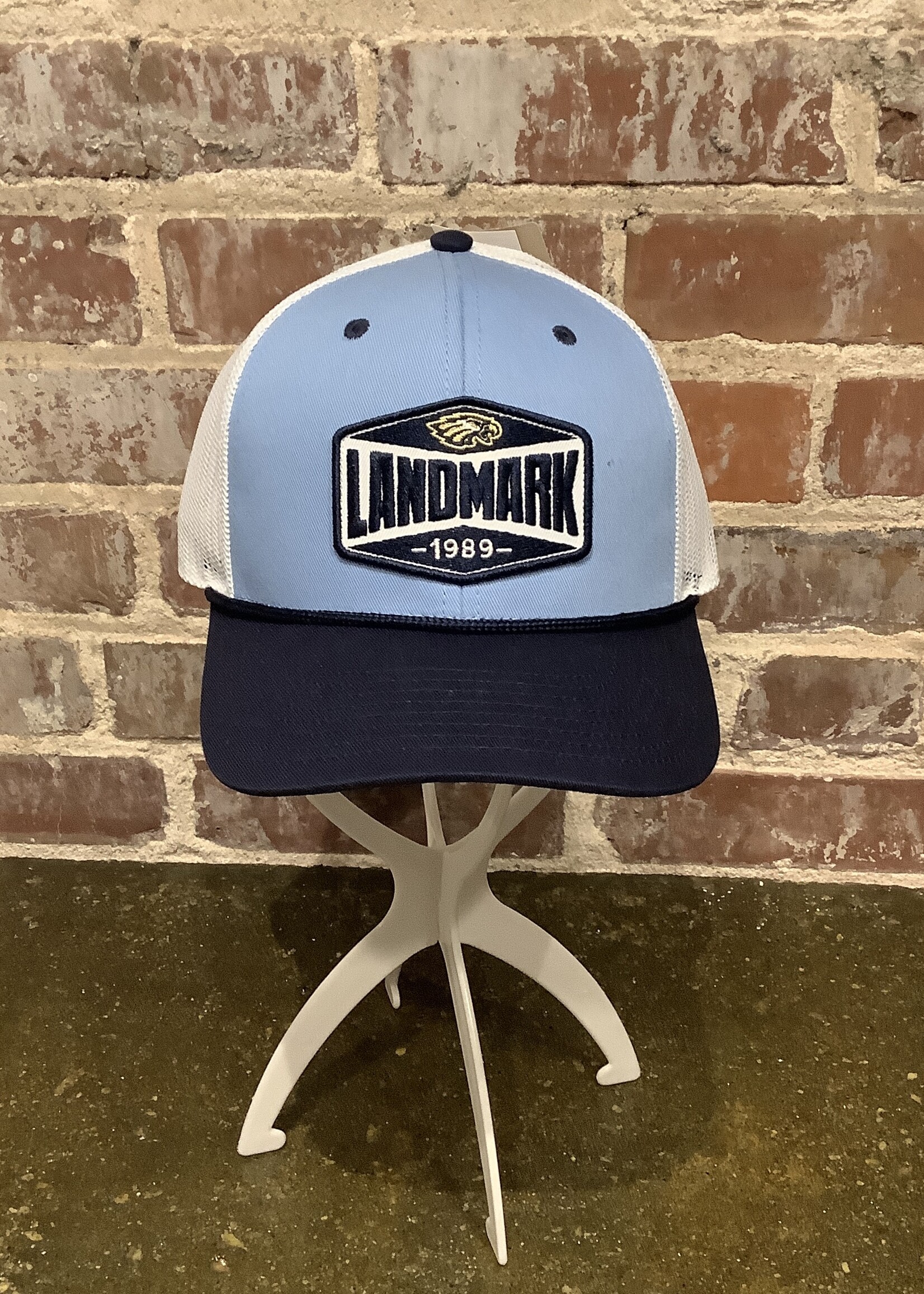 THE GAME ADULT TRUCKER HAT IN COLUMBIA BLUE WITH NAVY ROPE AND FRONT PATCH