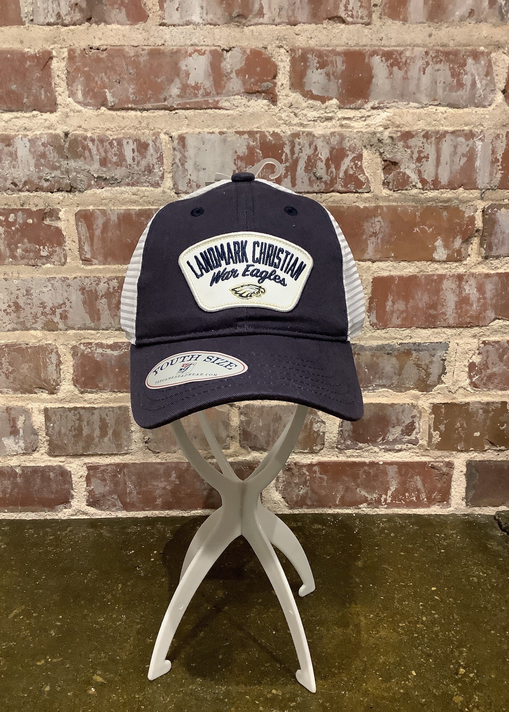 THE GAME TRUCKER YOUTH HAT IN NAVY WITH WHITE MESH AND PATCH FRONT