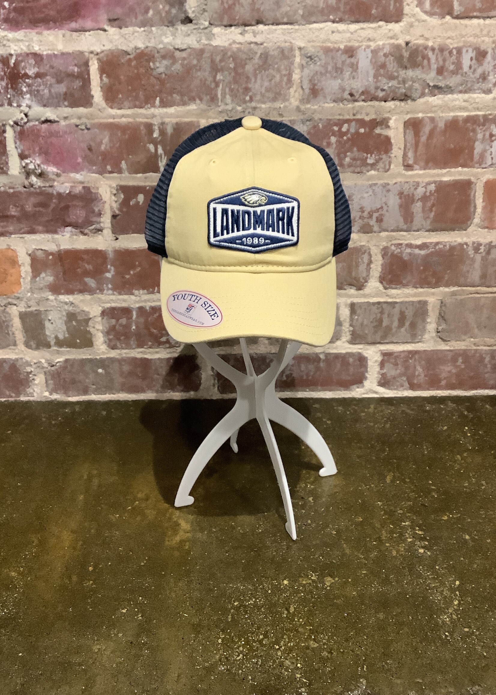 THE GAME TRUCKER YOUTH HAT IN VEGAS GOLD AND NAVY MESH