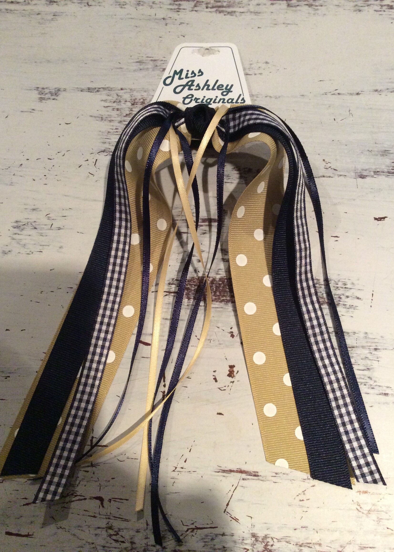 GOLD DOT RIBBON WITH MULTI STREAMERS ON PONY #7518D