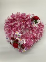 My New Favorite Thing Wreath Heart made from Pink Plastic Tablecloth with Red Hearts and Roses and Candy Ribbon