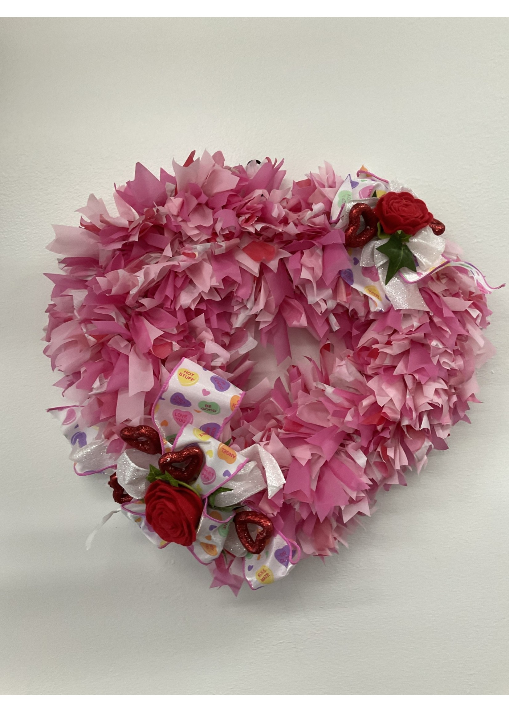 My New Favorite Thing Wreath Heart made from Pink Plastic Tablecloth with Red Hearts and Roses and Candy Ribbon