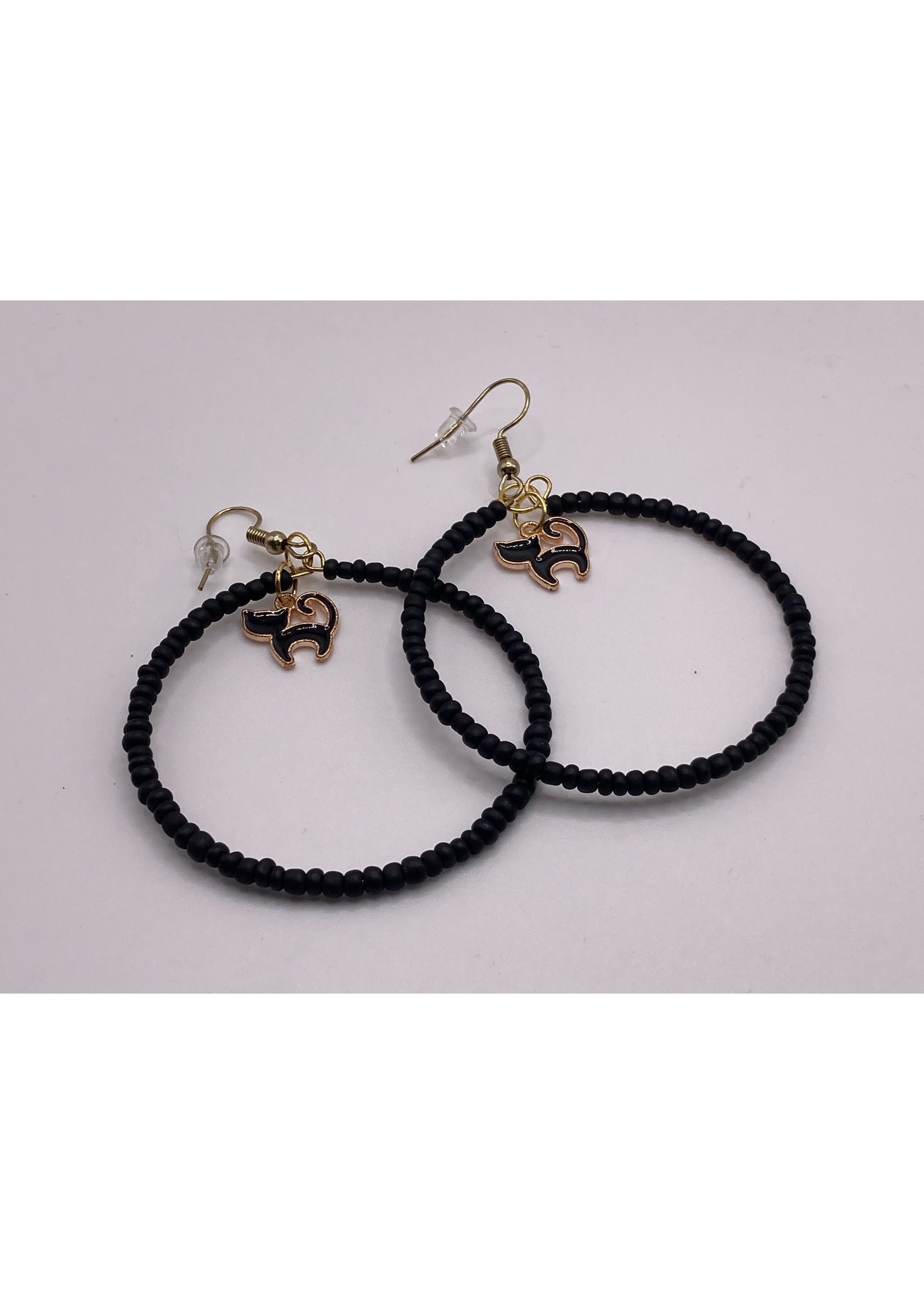 Our Twisted Dahlia Black Seed Hoops with Black Cat Charm Earrings