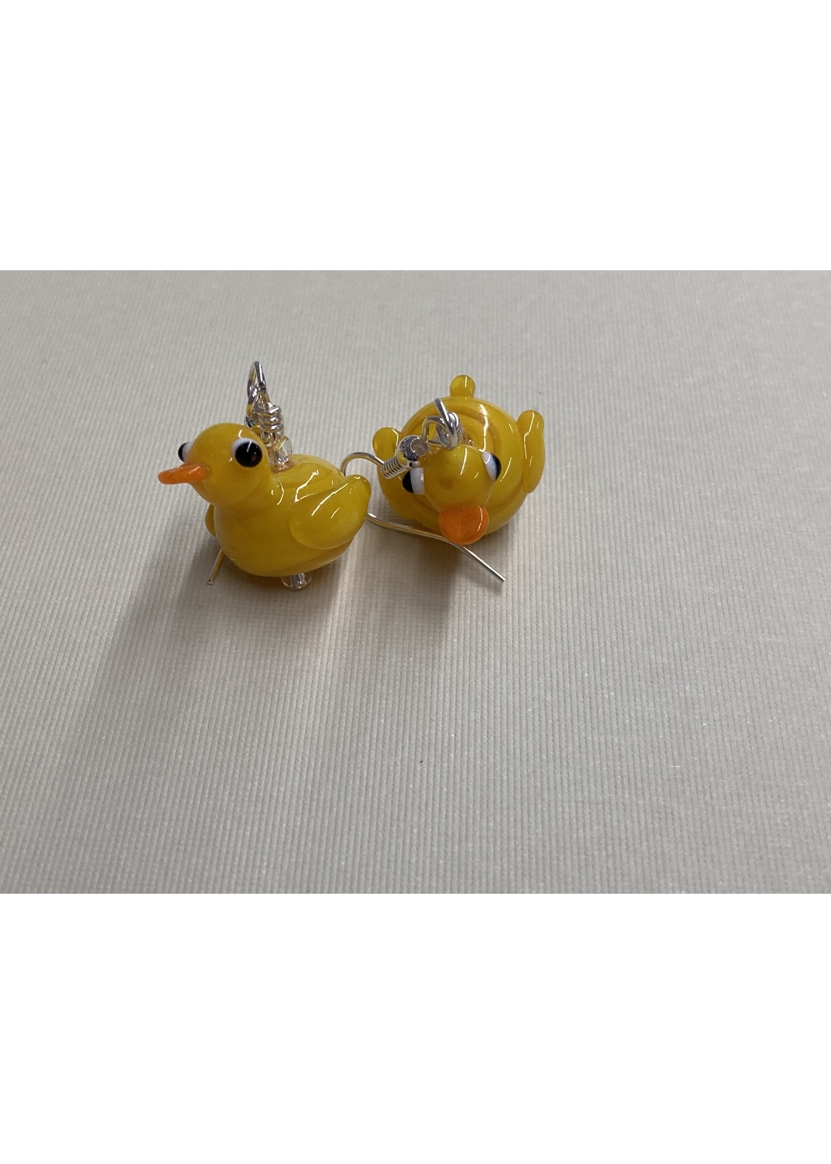 https://cdn.shoplightspeed.com/shops/654355/files/53807545/1652x2313x2/our-twisted-dahlia-e006-blown-glass-duck-earrings.jpg