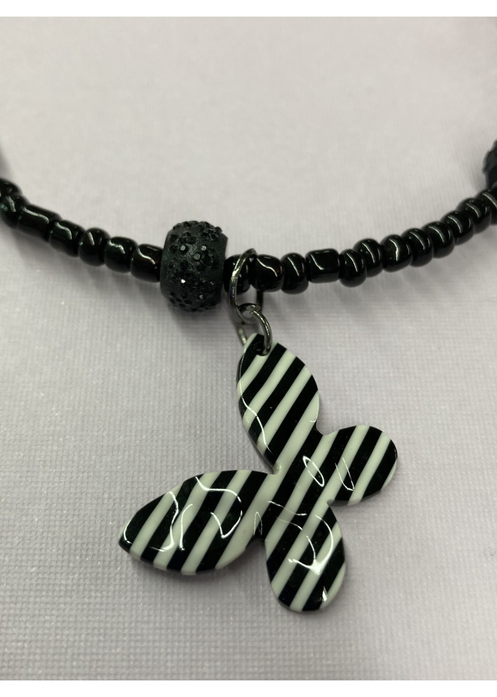 Our Twisted Dahlia Ch005 Black Beads with Black and White Stripe Butterfly Charm Choker
