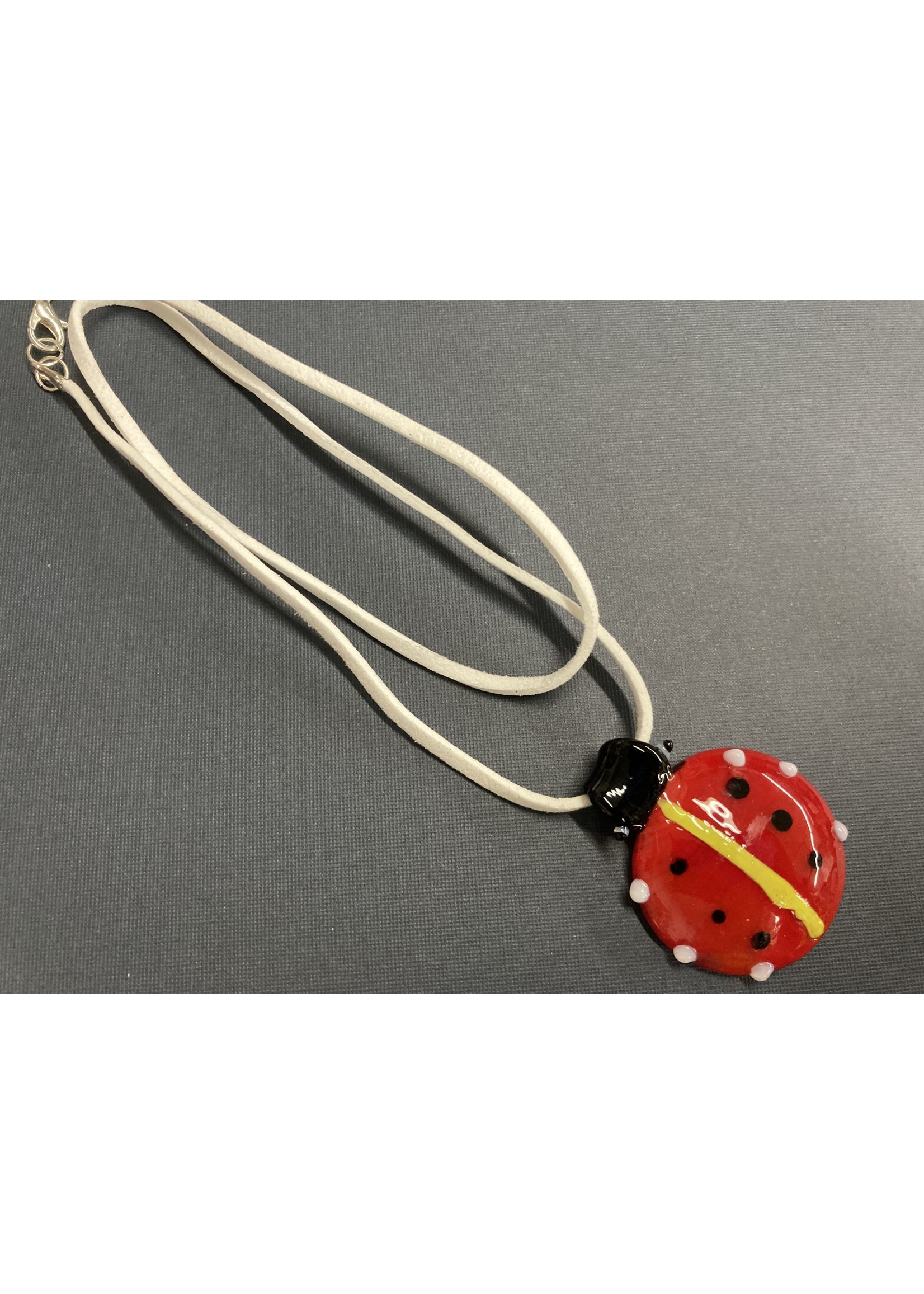 Our Twisted Dahlia N217 Hand Made Glass Ladybug Pendant with a Suede Necklace