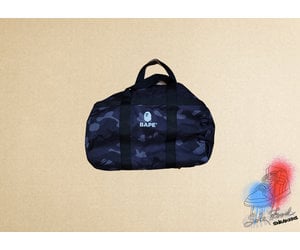 A BATHING APE® x Outdoor Products Camo Duffle Bag - Farfetch