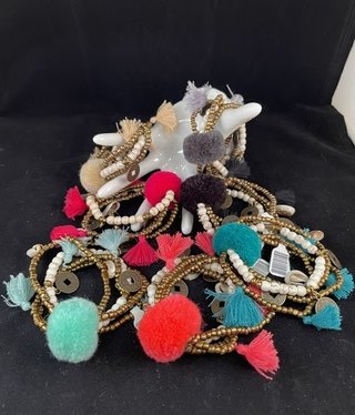 available at m. lynne designs Cream Big Pom Bracelet with Tassles and Coins