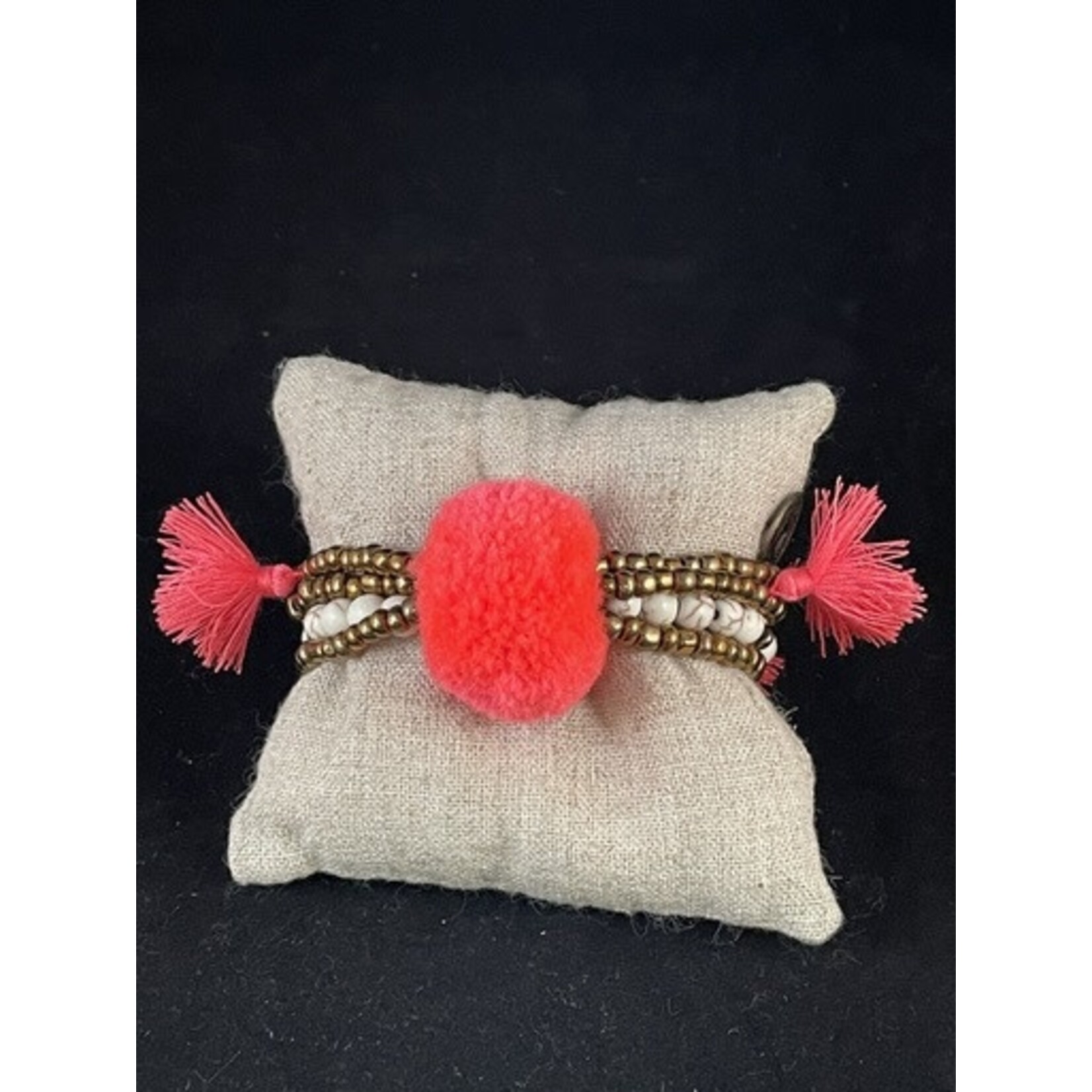 m. lynne designs coral big pom bracelet with tassels and coins