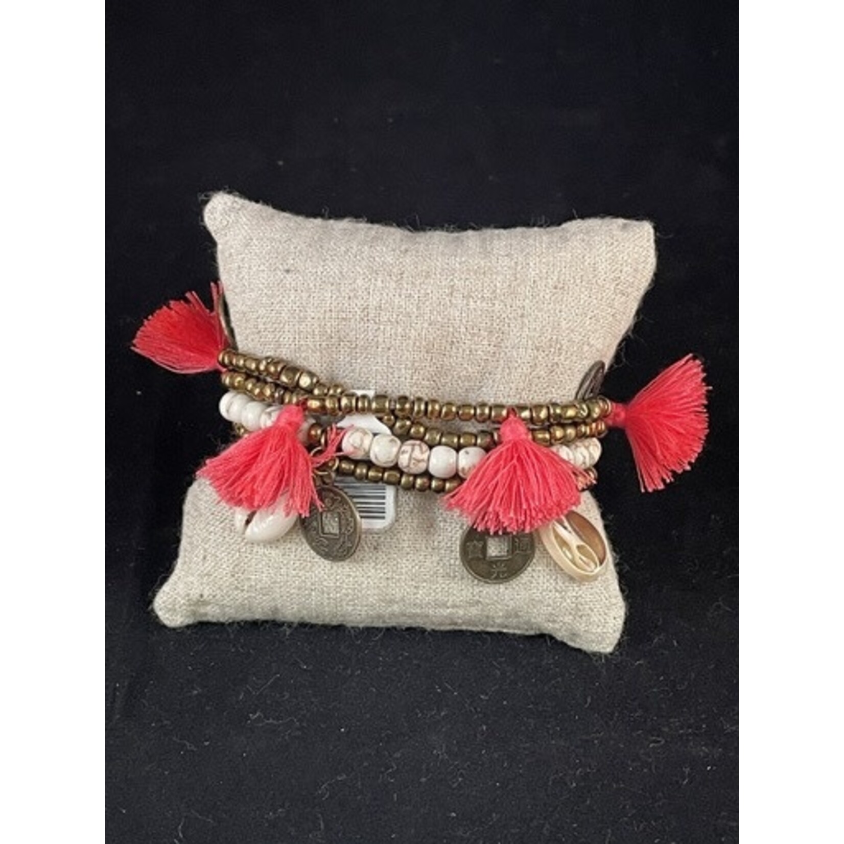m. lynne designs coral big pom bracelet with tassels and coins