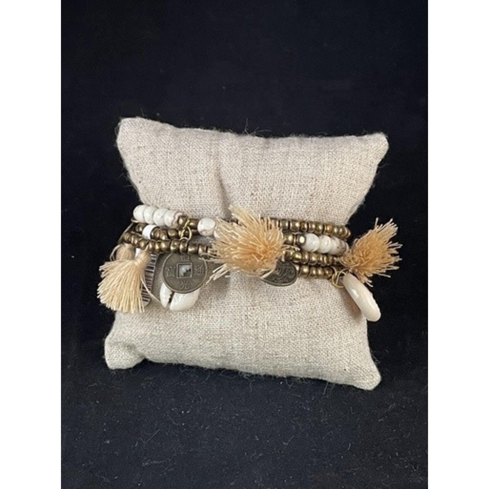 m. lynne designs cream big pom bracelet with tassels and coins