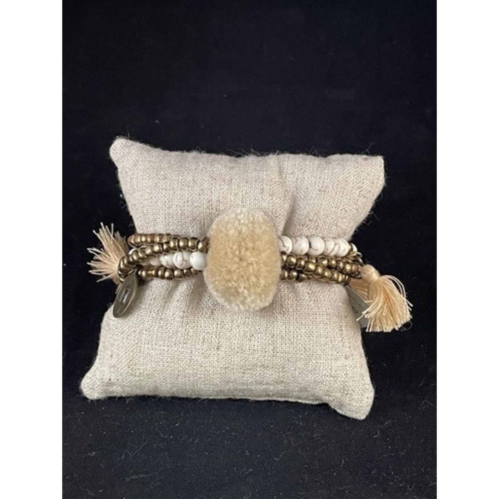 m. lynne designs cream big pom bracelet with tassels and coins