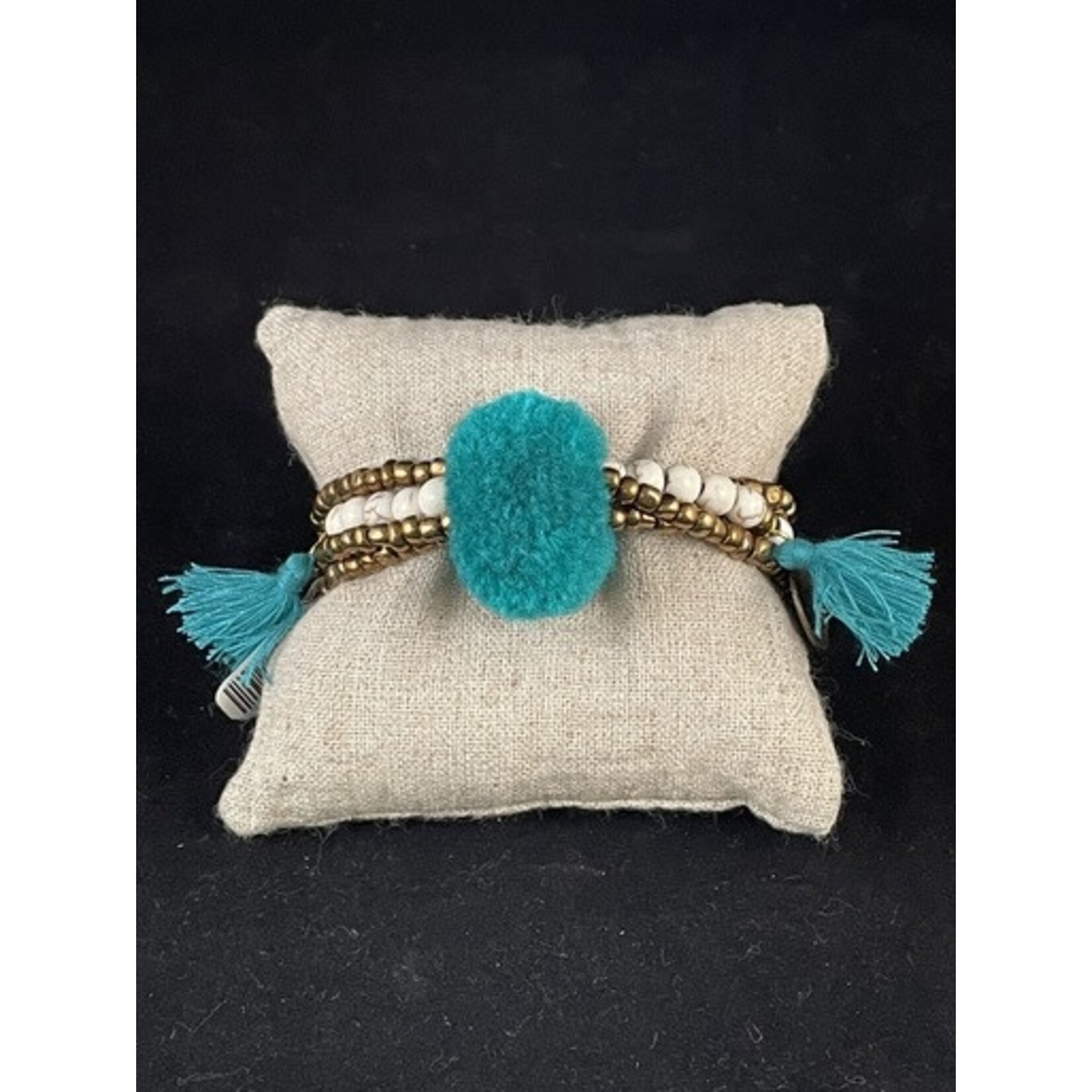 m. lynne designs teal big pom bracelet with tassels and coins
