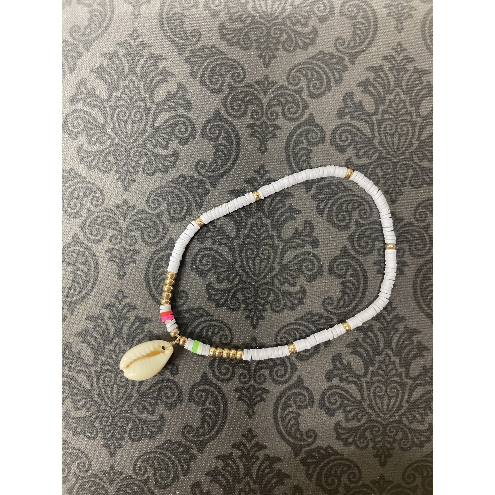 m. lynne designs white disc with colorful accents and shell bracelet
