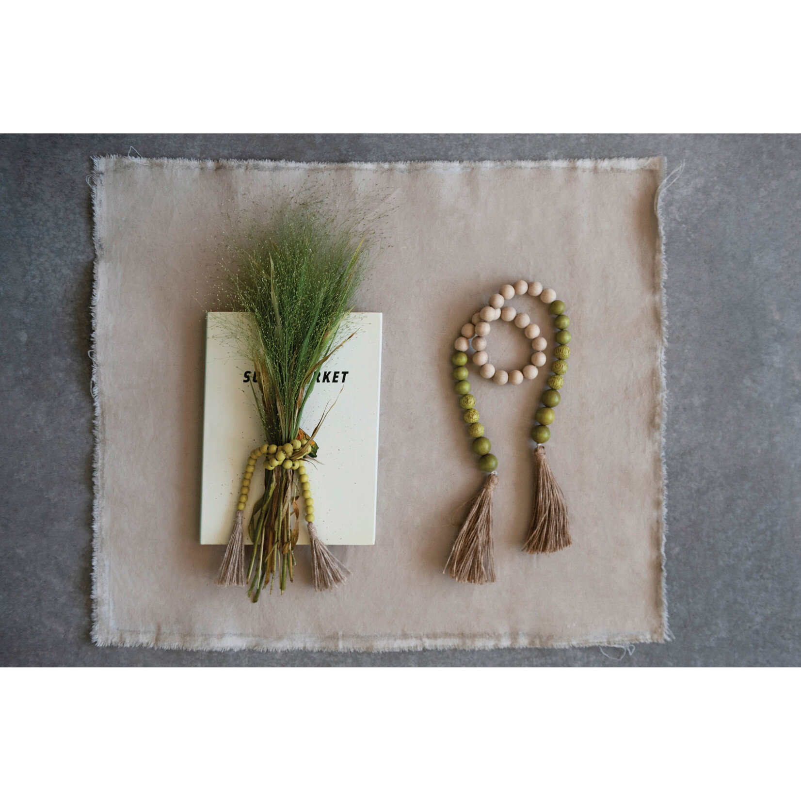 m. lynne designs lime wood bead garland with jute tassels