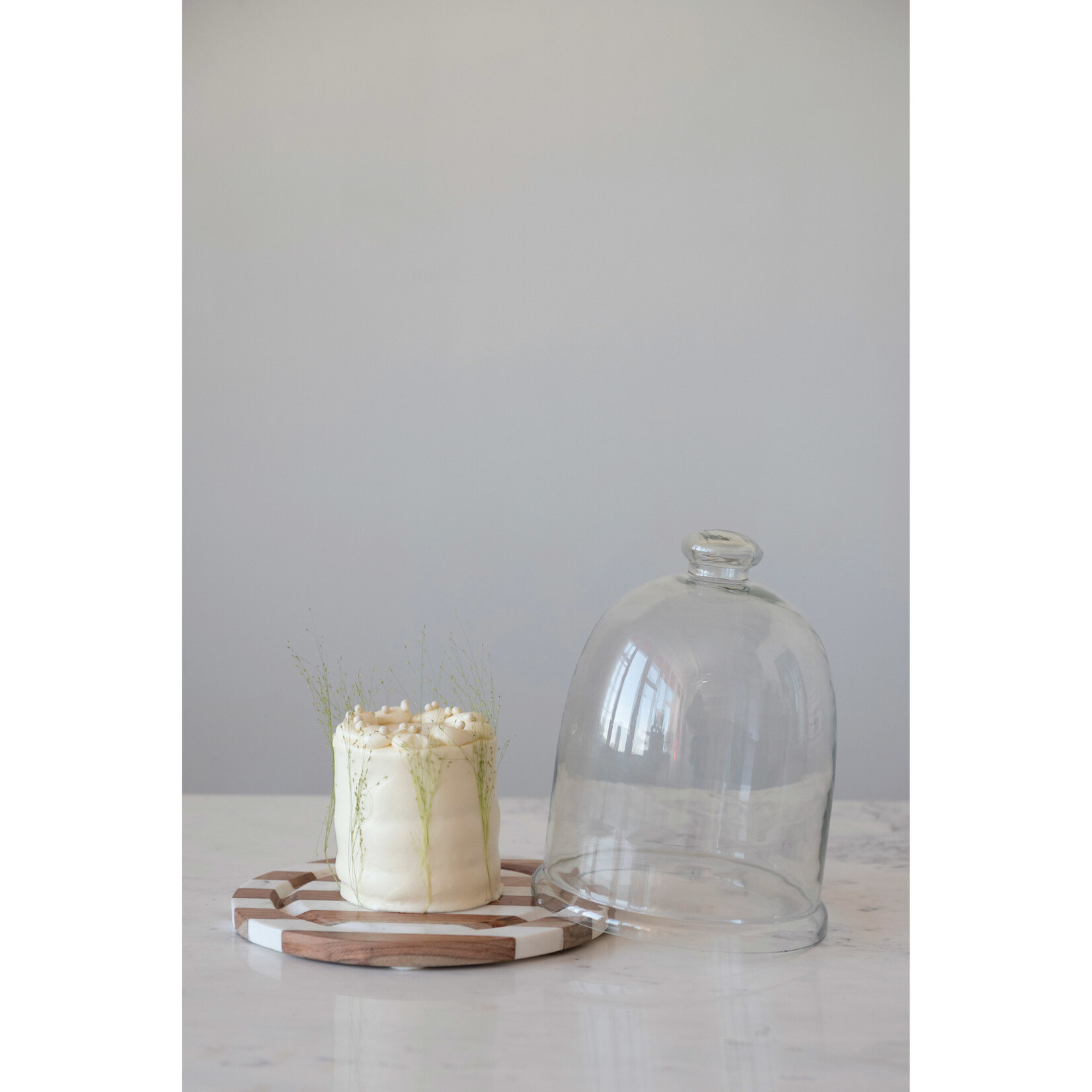 m. lynne designs cloche with striped wood & marble base
