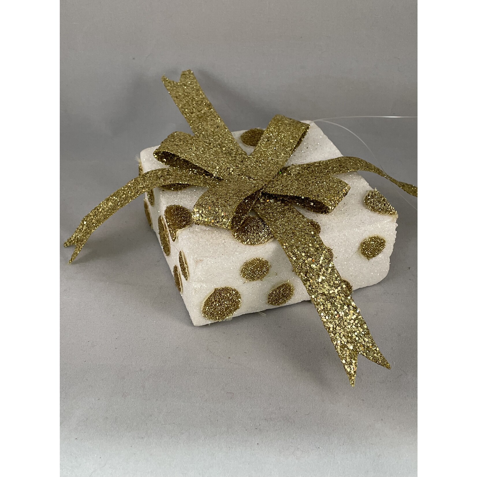 m. lynne designs gold package ornament