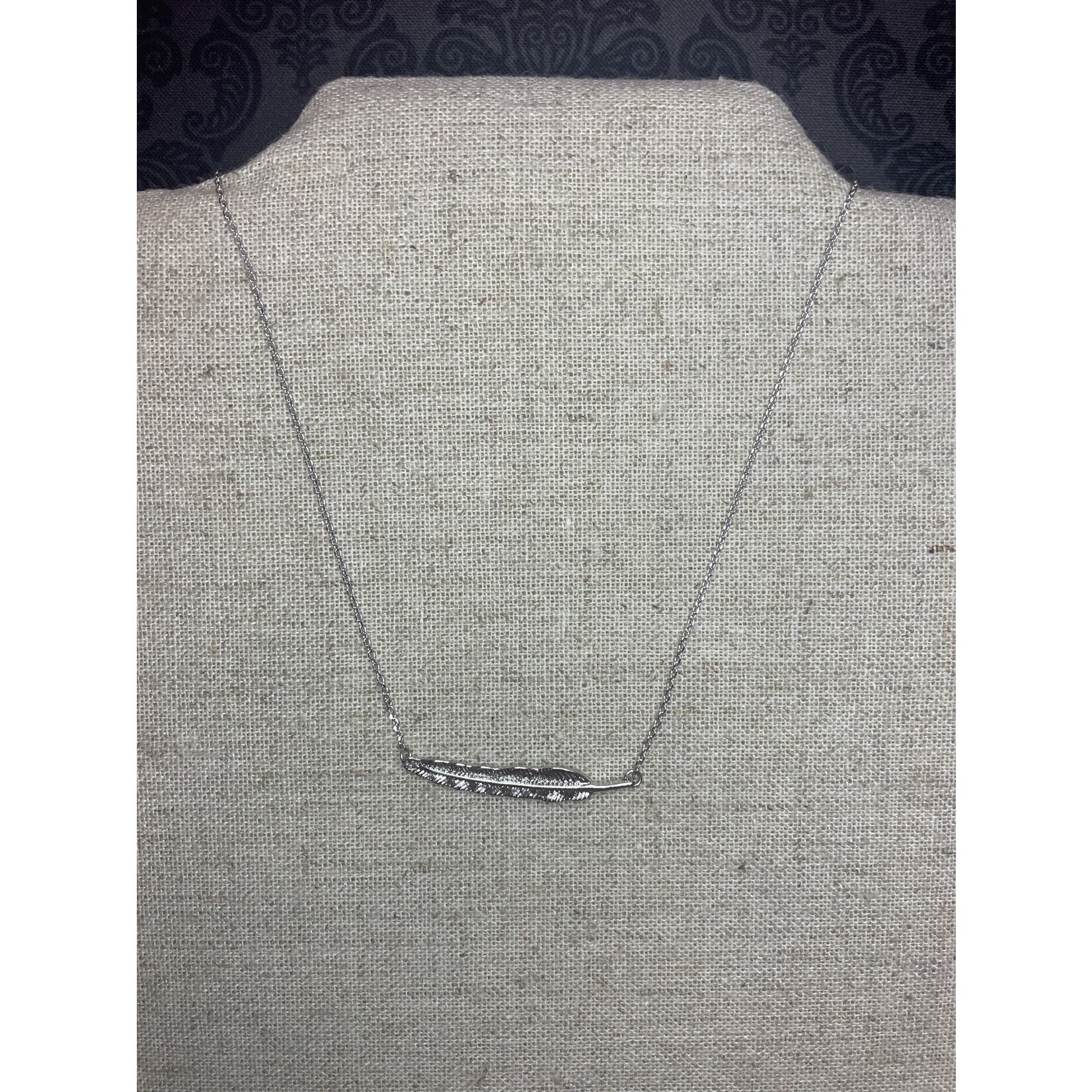 available at m. lynne designs delicate feather necklace