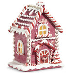 m. lynne designs pink lighted gingerbread house with holly above window