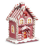 m. lynne designs pink lighted gingerbread house with wreath above windows