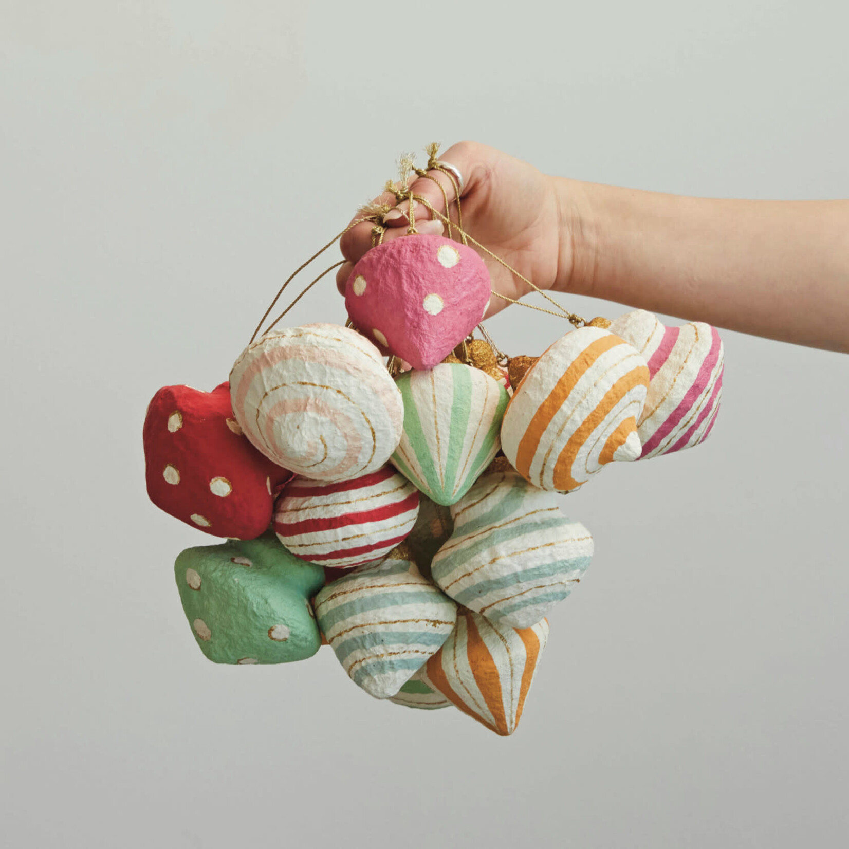 m. lynne designs paper mache ornament with reds, greens and blues
