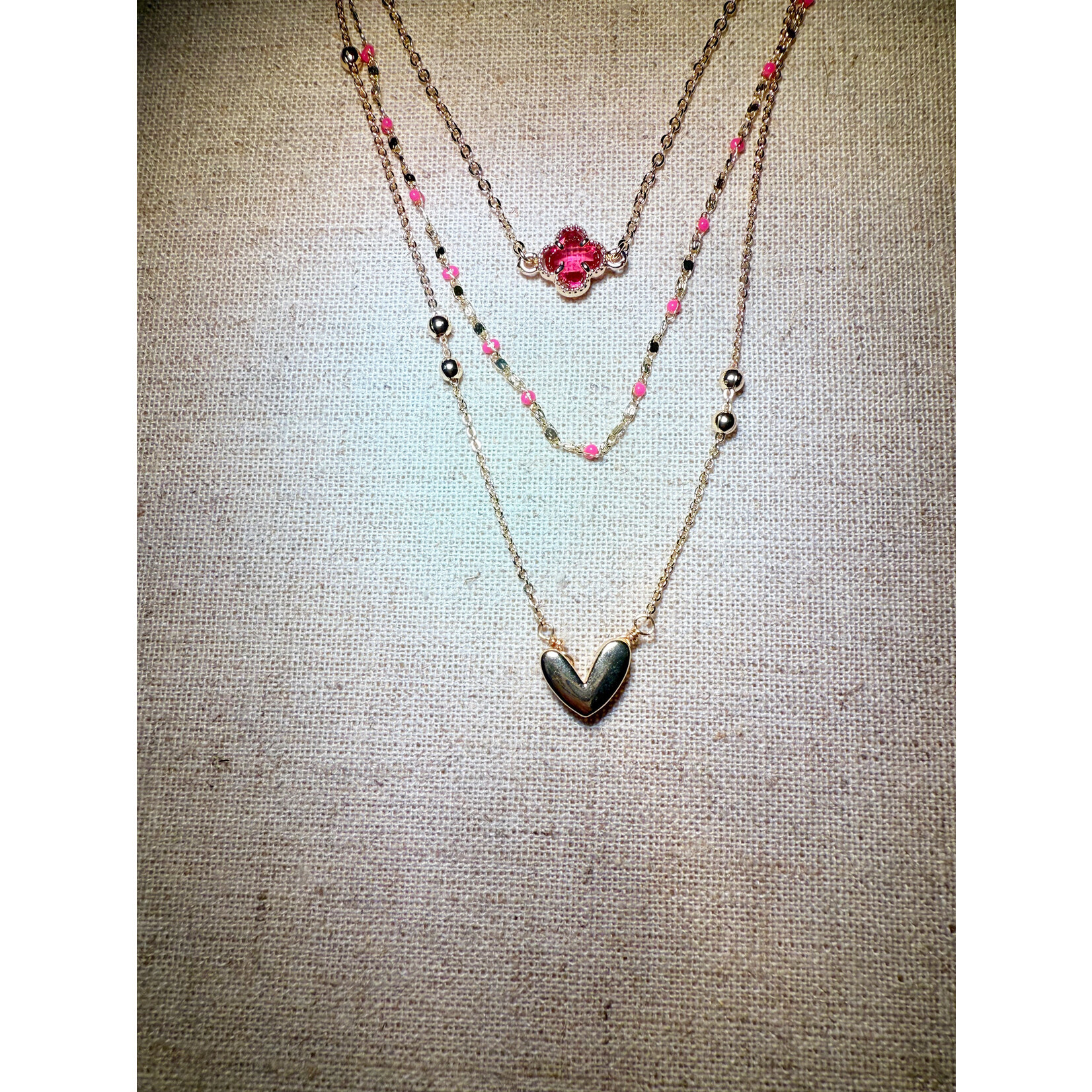 m. lynne designs gold multi-chain necklace with pink accents and gold heart