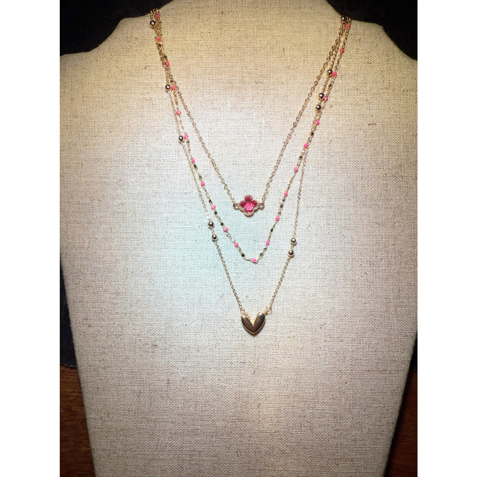 m. lynne designs gold multi-chain necklace with pink accents and gold heart