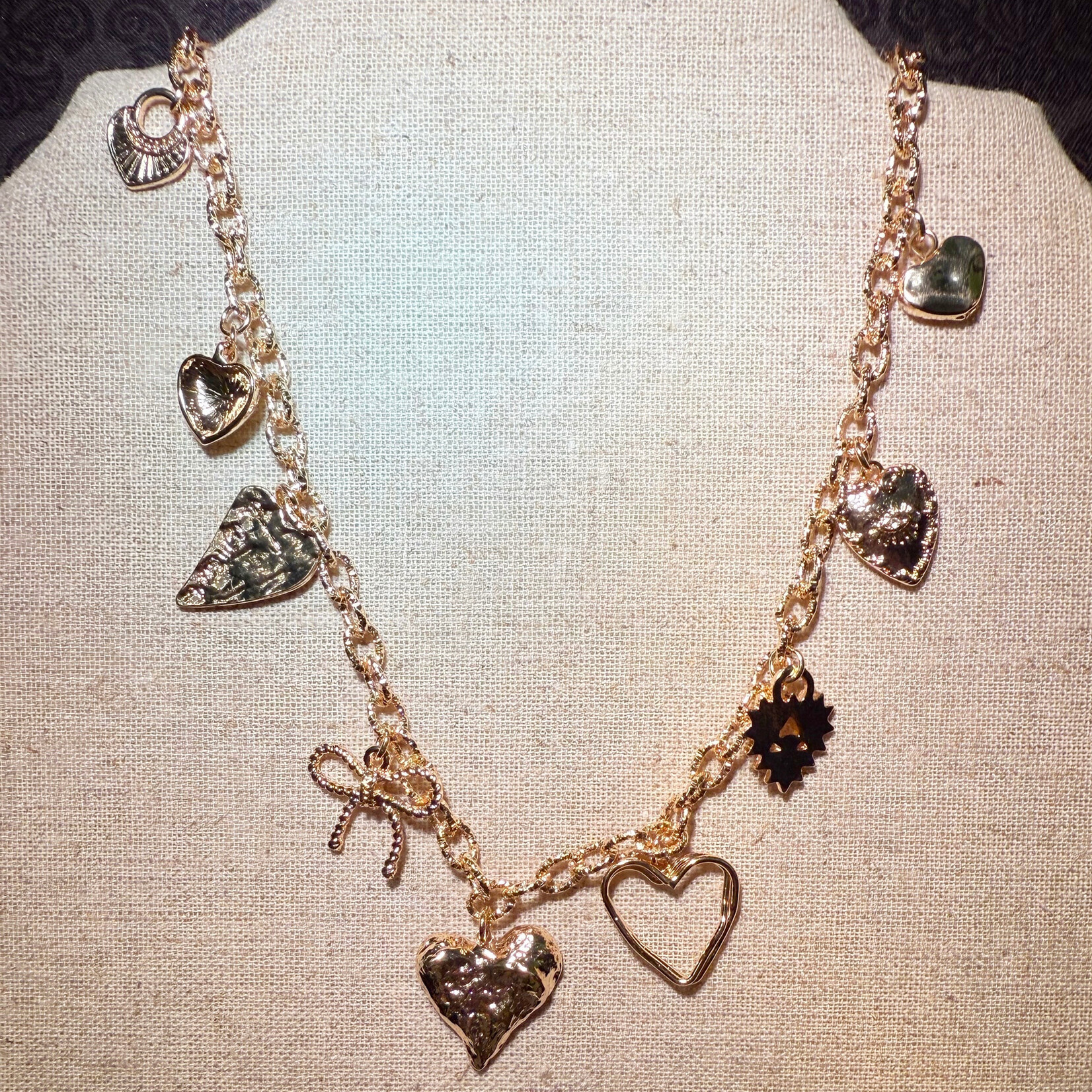 m. lynne designs gold link necklace with heart and bow charms