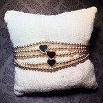 m. lynne designs gold bead bracelet with black hearts