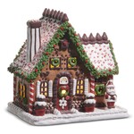 m. lynne designs lighted gingerbread house with chocolate with kisses on roof
