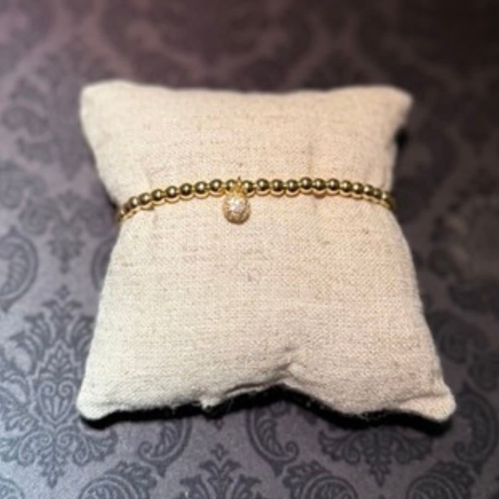 stainless gold bead bracelet with sparkly charm
