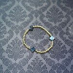 m. lynne designs stainless gold bead bracelet with black clover