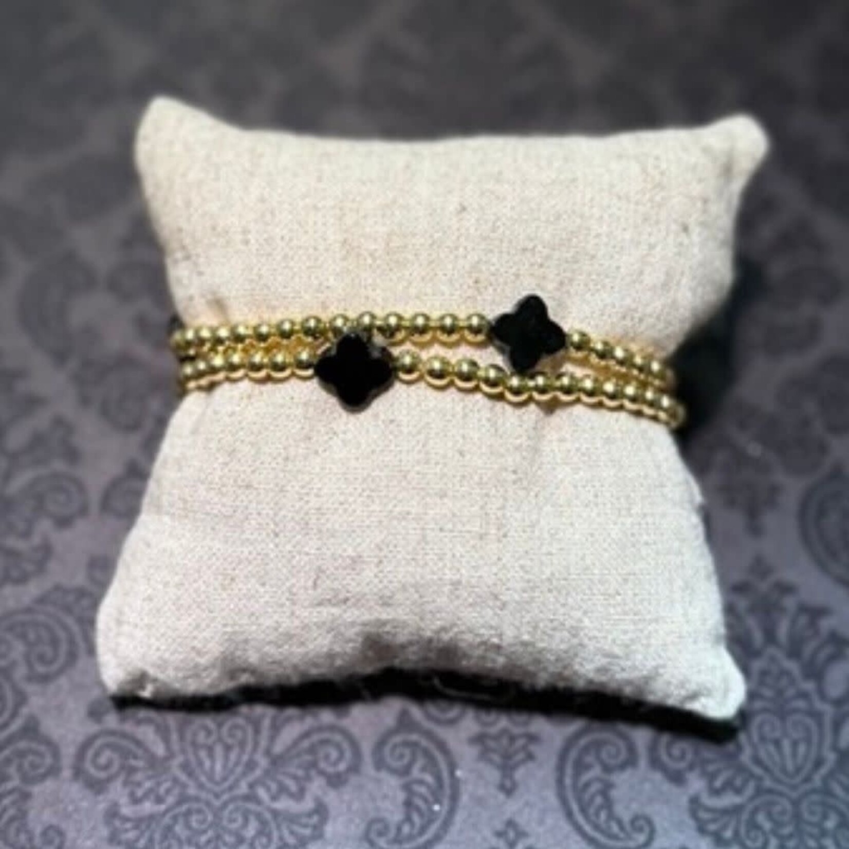 m. lynne designs stainless gold bead bracelet with black clover