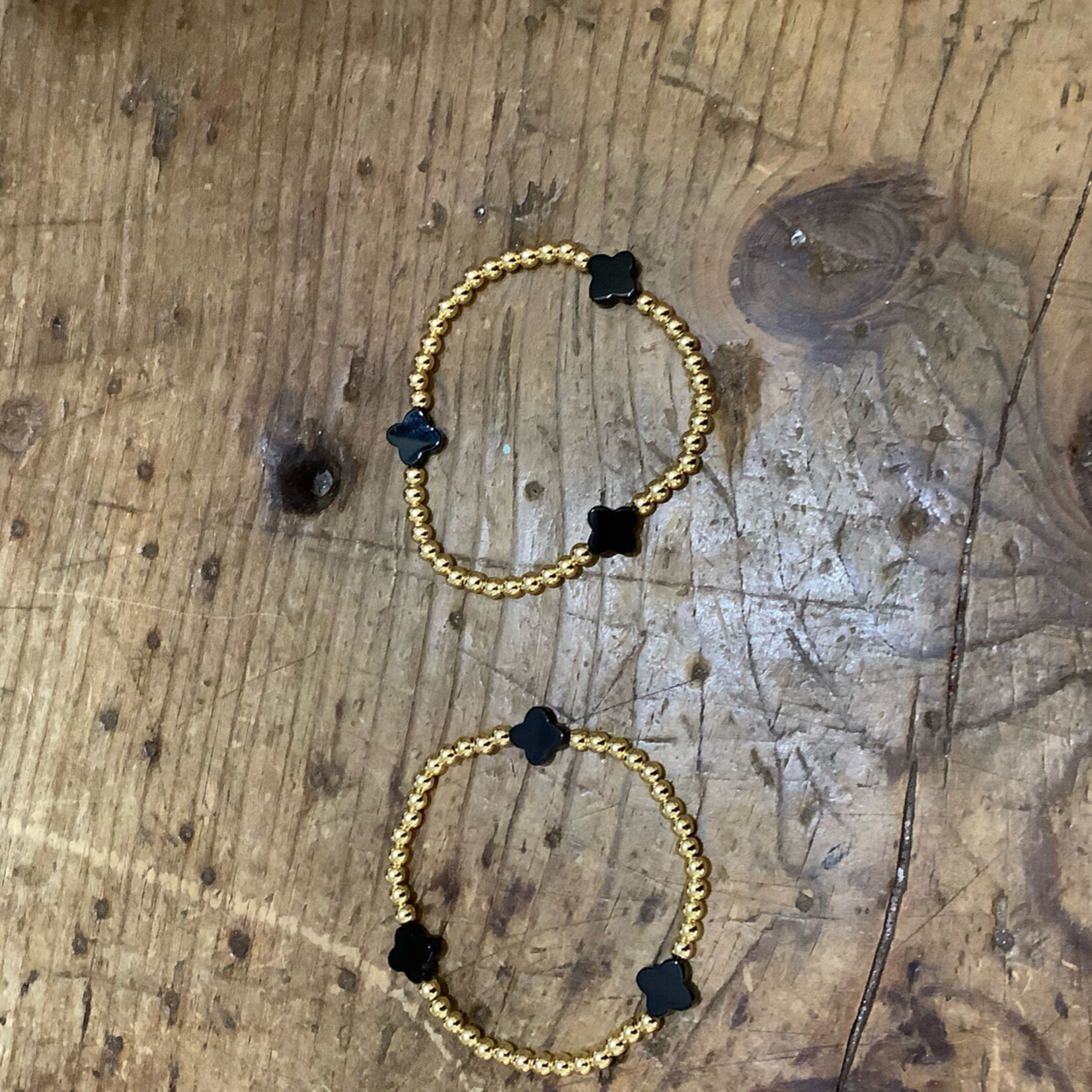 m. lynne designs stainless gold bead bracelet with black clover