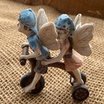 Fairies Riding Tricycle