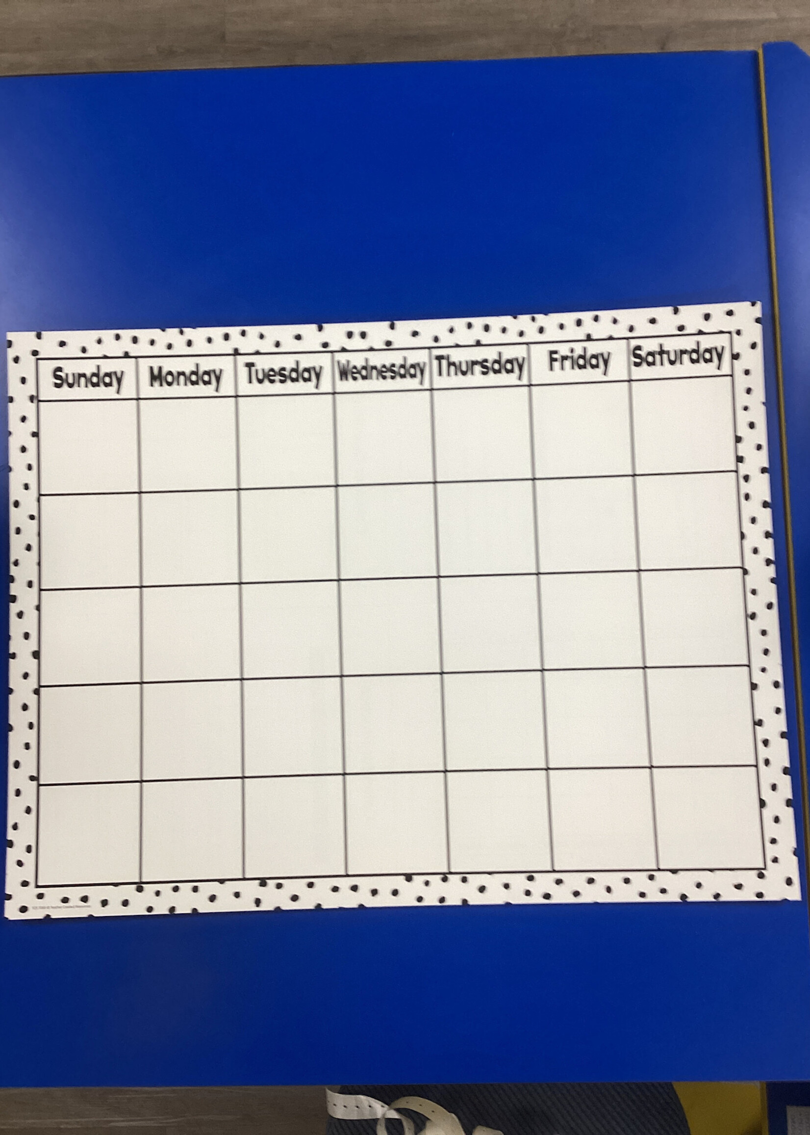 Black Painted Dots on White Calendar Chart