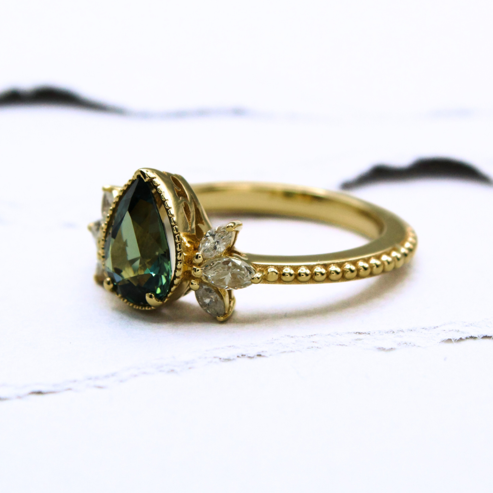 Mckay Diamonds Green-Blue Sapphire Ring with Marquise Diamond Accents and Beaded Detail