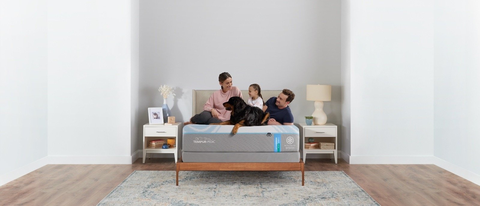 Family relaxing on a bed