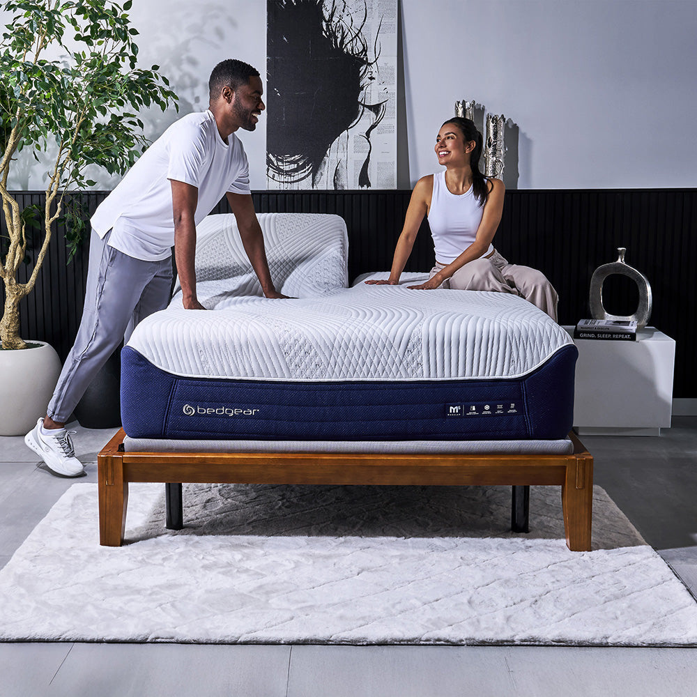 Couple feeling the support of an M5 mattress