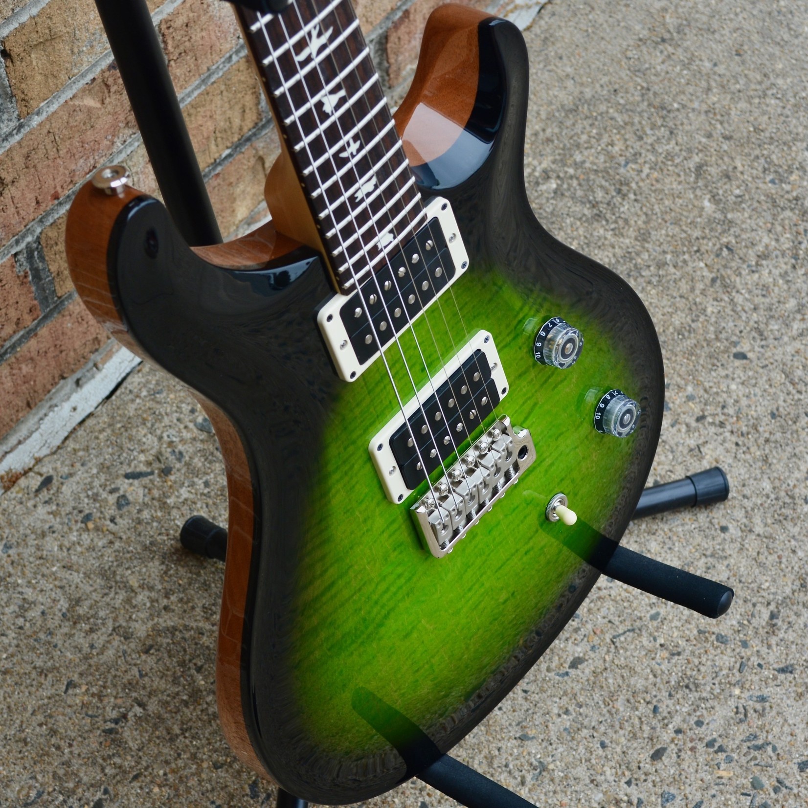 black and green guitar