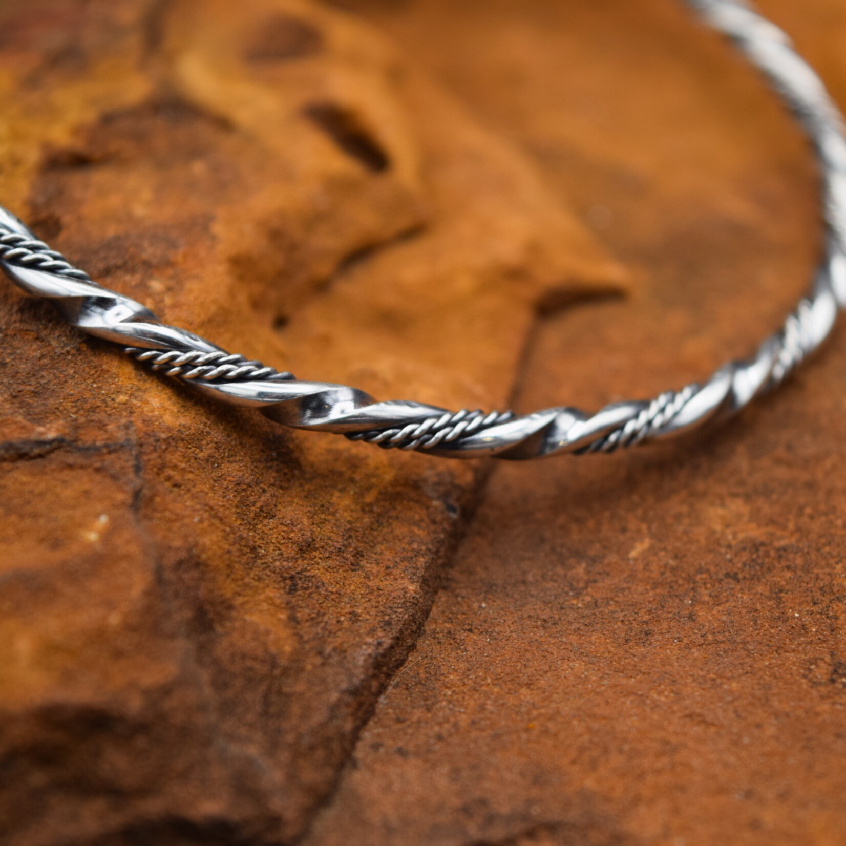 SILVER BRAIDED TWIST BANGLE BRACELET