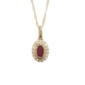 GBC (R) 14KY .22CT RUBY .07CT DIA HALO PENDANT