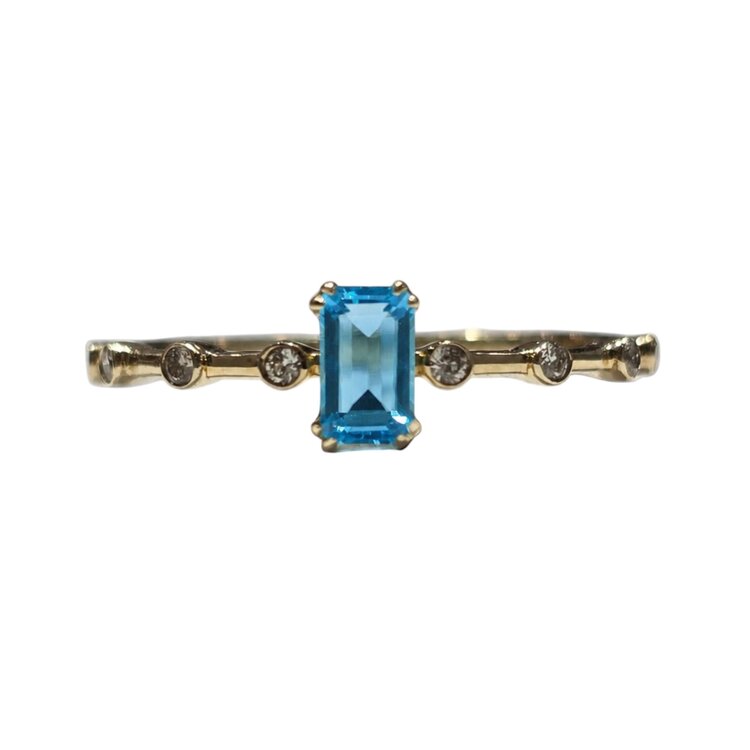 DIAMOND TRADERS INTERNATIONAL (X) 10KY .38CT BLUE TOPAZ  EM CUT CENTER .08CT DIAMOND RING