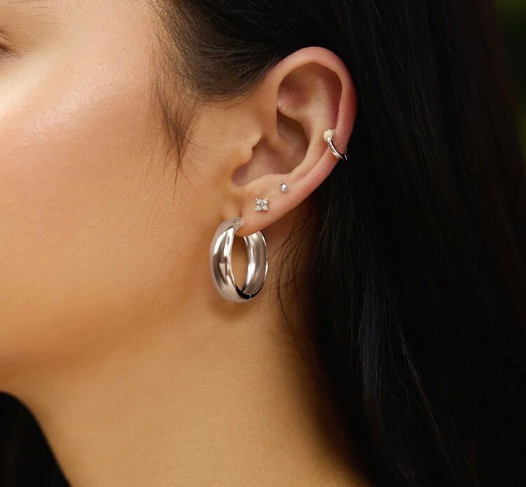 ANIA HAIE Silver Four-Petal Stud Earrings Material: 925 Sterling Silver with Rhodium Plating with Cubic Zirconia • Earring Size: 6 x 6mm • Weight: 0.6g