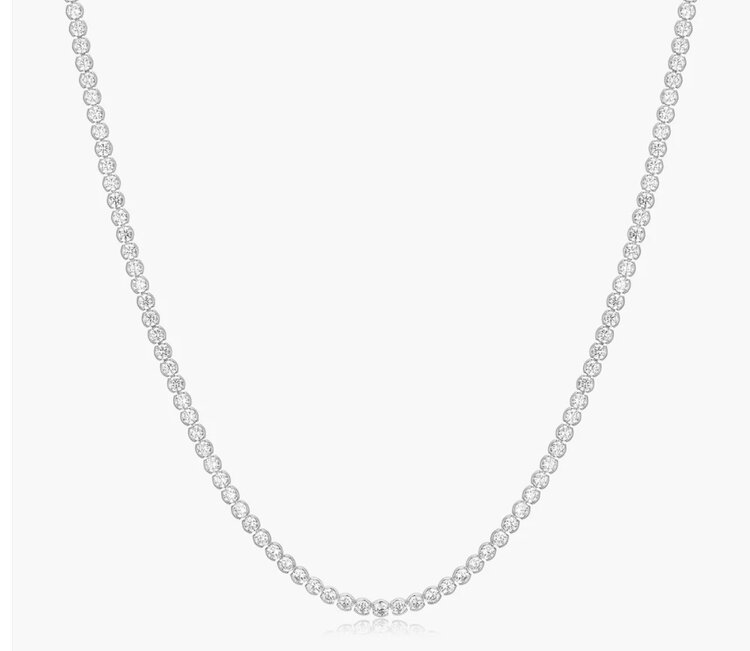 ANIA HAIE ANIA HIE Silver Half-Bezel Round Tennis Necklace, Brilliant, refined, and quietly distinctive. A tennis necklace of round cubic zirconia stones in half-bezel settings—designed to catch every sparkle. Unique enough to stand out.